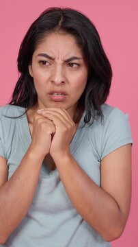 Disgusted young woman expressing repulsion and dislike