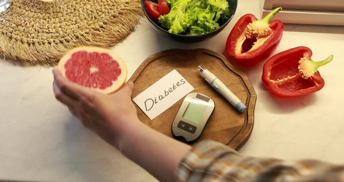Diabetes. Woman putting fresh vegetables, fruits, digital glucometer and lancet pen at white marble table, above view