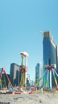 Vertical video attractions on the embankment, fast flow of people walking. Timelapse view of the famous buildings of Batumi, Georgia, Adjara region