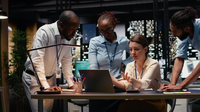 Time lapse of manager and staff engage in collaborative teamwork inside office, reviewing data and performance metrics on laptop. Diverse team planning project for effective strategy.
