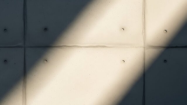 Close up view of a plain white tiled wall surface.