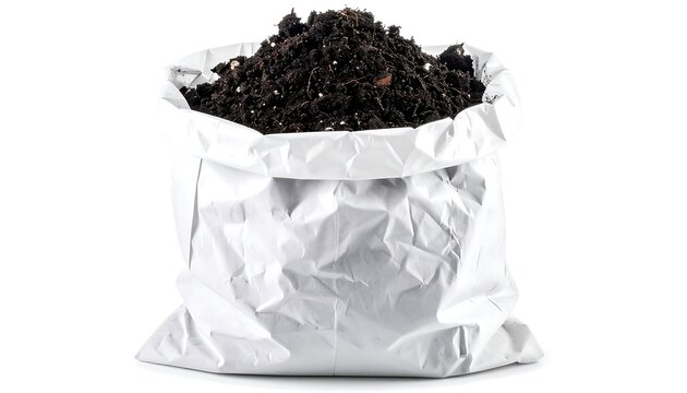 A crumpled silver foil bag overfilled with dark brown coffee beans on a plain white background