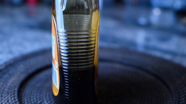 Syrup inside of the bottle from a side ways perspective. 