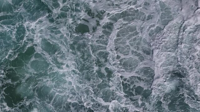 Foamy Ocean Waves Along Natural Coastline