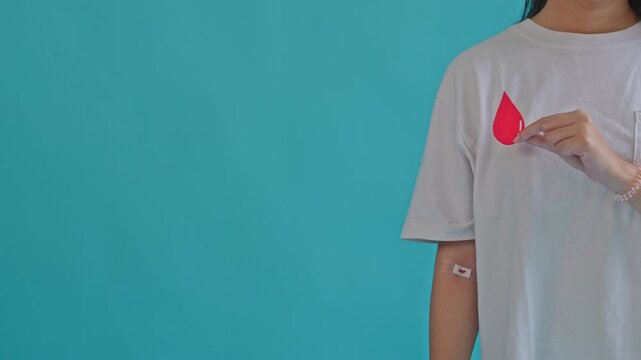 Close-up Slow Motion Blood Donation Process with Medical Tube and Collection Bag in Clinical Setting