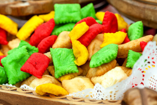 Colorful Boorsok (Baursak), a traditional festive snack from Kyrgyzstan and Kazakhstan, deep-fried dough pillows in bright colors.