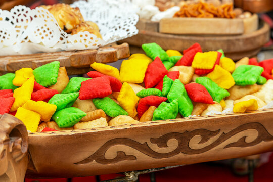 Colorful Boorsok (Baursak), a traditional festive snack from Kyrgyzstan and Kazakhstan, deep-fried dough pillows in bright colors.