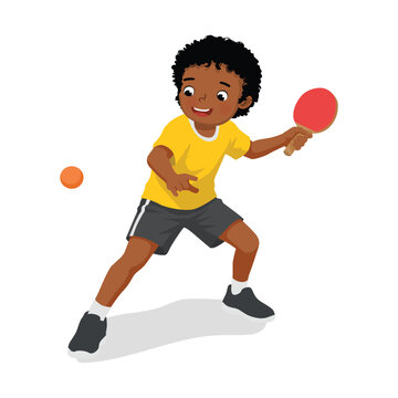 Little African boy playing table tennis hitting the ping pong ball with paddle
