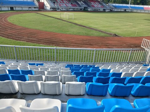 White and blue empty seats in stadium