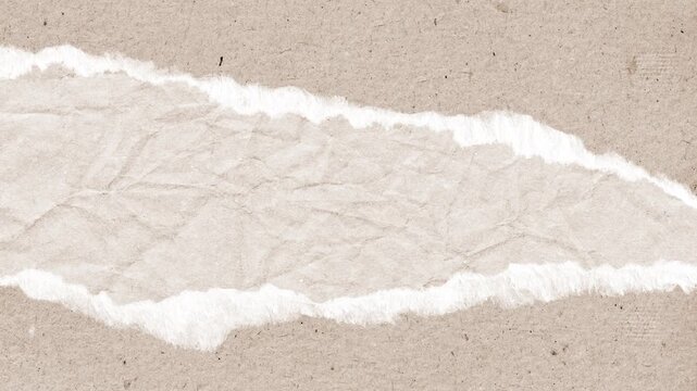 Ripped brown recycled paper texture revealing crumpled white parchment underneath in this high quality motion background animation video design element