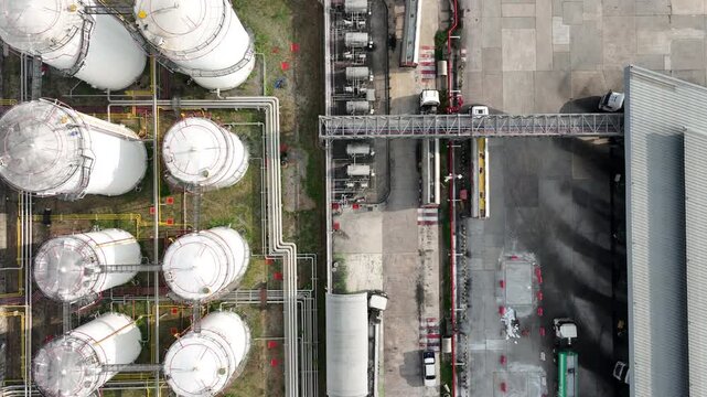 Aerial view white oil storage tank with pipeline steel, Crude oil industry, Storage fuel gas container tank petroleum refinery industrial factory, Oil storage chemical petrochemical refinery product.