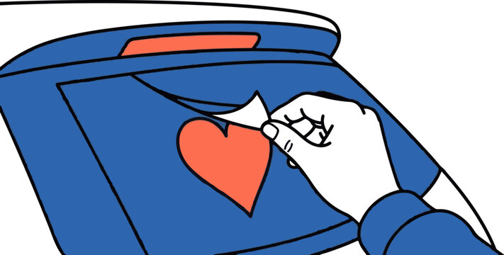 Hand placing love heart into blue mailbox slot.