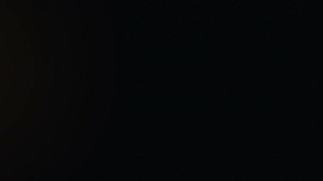 Real Cinematic Lens Flare Overlay on Black Background, 1000fps Slow Motion, Warm Optical Light Leak, Golden Bokeh Shimmer, Anamorphic Film Aesthetic 4k video