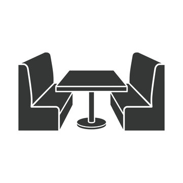 A booth seating arrangement with two benches and a table indoors