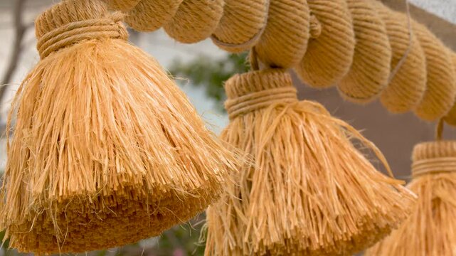 Traditional Shimenawa Sacred Rope with Tassels at Japanese Shinto Shrine