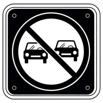 No passing road sign featuring two cars with a slash through them indicating that drivers are strictly prohibited from overtaking other vehicles on this specific stretch of highway road today