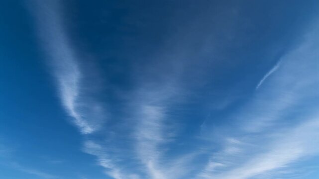 Blue Sky with Wispy White Clouds on a Clear Day.