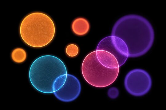 Colorful abstract circles in vibrant hues on a dark background.