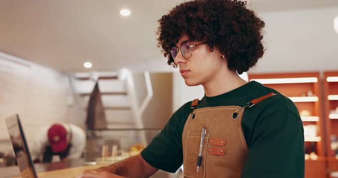 Laptop, man and barista thinking in cafe for menu ideas, typing or order stock. Coffee shop, owner and computer in small business for planning inventory with online sales, review and problem solving