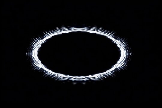 Abstract white circular light pattern on a black background