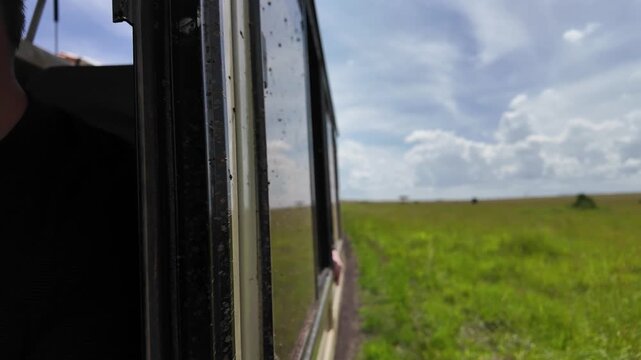 First Person Perspective of Moving Safari Car in Wild Kenya Grasslands