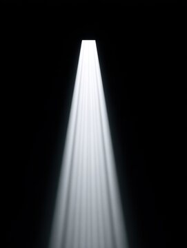 A beam of light illuminated against a dark background, creating a mysterious atmosphere.