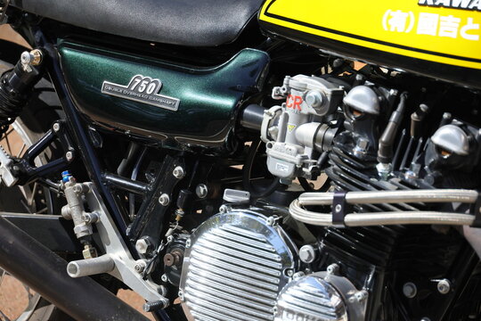 Close up of a classic 750cc motorcycle engine and carburetor.