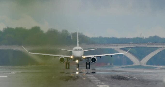 Plane takes off from Washington DC's Reagan National Airport on rainy morning