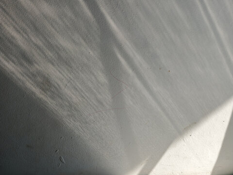Shadow and Light Streaks on White Wall Texture
