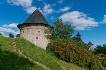 Obraz premium Tailovskaya Tower of the Holy Dormition Pskov-Pechersk Monastery on a sunny summer day, Pechory, Pskov region, Russia