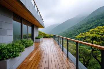 Obraz premium Modern balcony overlooking green mountains and misty forest
