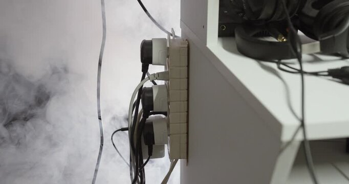 Smoking Power Strip with Overloaded Electrical Cables Fire Hazard