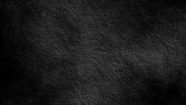 ​Dark charcoal textured paper background with visible grain