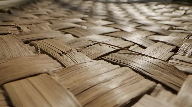 Closeup of a woven natural fiber mat texture.