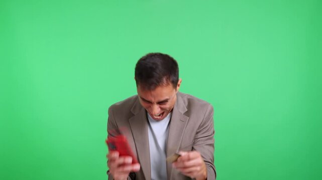 Excited compulsive shopper making online purchase on his smartphone