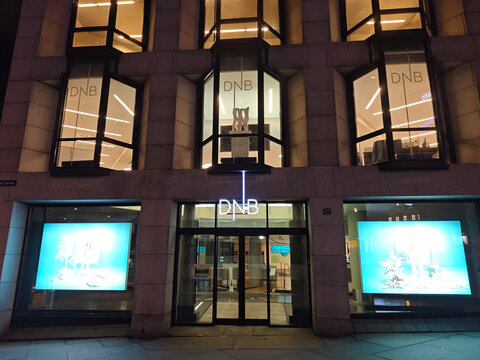 Oslo, Norway-Nov.25th 2025: Night exterior of a DNB Bank office building in downtown Oslo, Norway