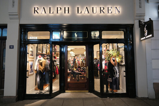 Oslo, Norway-Nov.25th 2025: Exterior view of a Ralph Lauren boutique storefront at night.