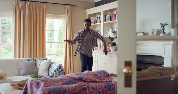 Dance, rhythm and black man in living room with energy for celebration, performance and expression. Happy, movement and male person with hip hop for hobby, entertainment and weekend fun in home