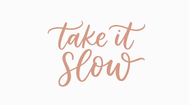 Take it slow hand lettered calligraphy quote on white background