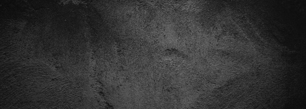 Dark grey stone texture with a rough, grainy surface, ideal for backgrounds, architectural design projects, or natural texture concepts.