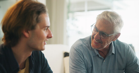 Fototapeta premium Love, home and elderly father with man for conversation, connection and bonding together on weekend. Senior dad, son or talking on sofa with parent for advice, smile and support in living room