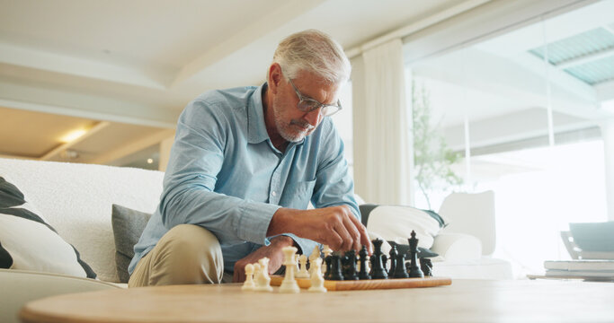 Man, chess and game in home with strategy, solution or problem solving in contest in living room. Mature person, boardgame and idea with competition for thinking, knowledge or challenge in lounge