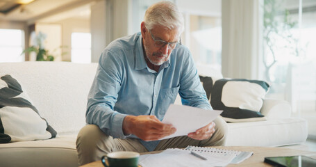 Reading, documents and senior man on sofa with planning for insurance, retirement or assets in home. Policy, pension letter and person with paperwork for financial investment, savings or mortgage