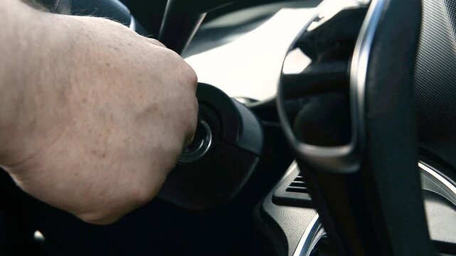 Driver rotating ignition key to launch vehicle