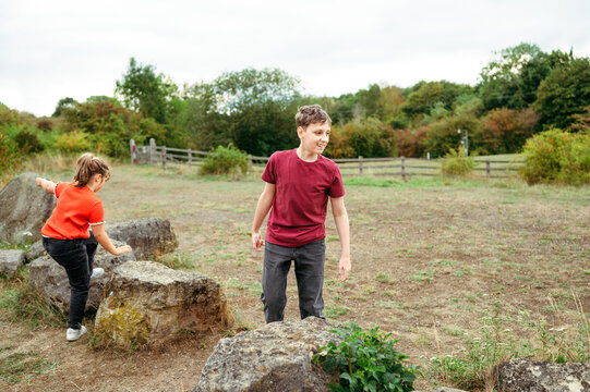 Brother and sister exploring countryside together
