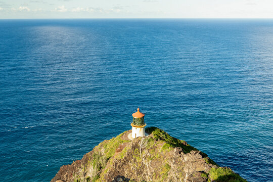The Makapuʻu Point Lighthouse under a blue sky in Hawaii