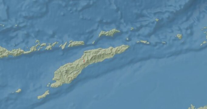 Timor-Leste on Globe. Zoom into the country with Earth spinning on dark background. Physical world map with Timor-Leste and label on it. Country view animation.