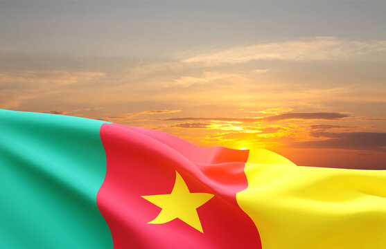 Waving flag of Cameroon against the sunset. National Holidays concept