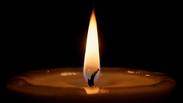 Single wax light glowing brightly in pitch black room, small warm flame burning slowly on round plate base, peaceful religious faith item shining in darkness, calm meditative mood context layout