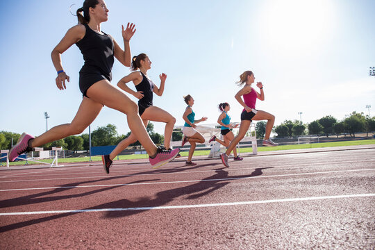 Female runners on tartan track